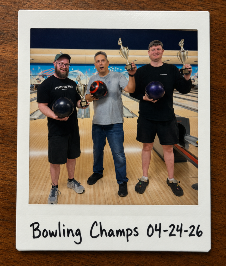 Jaime and his teammates pose in a bowling alley holding bowling balls and trophies inside a Polaroid-style photo frame. The bottom white border has handwritten black marker text that reads, “Bowling Champs 04-24-26.”